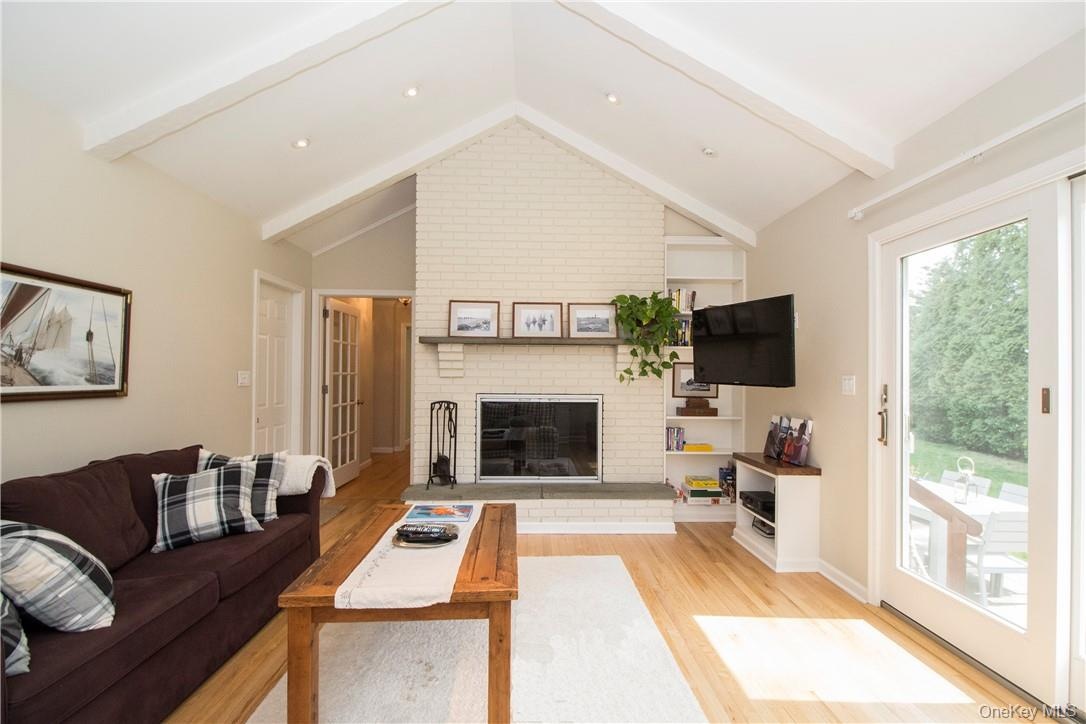 Family room with vaulted ceiling and sliding doors to backyard