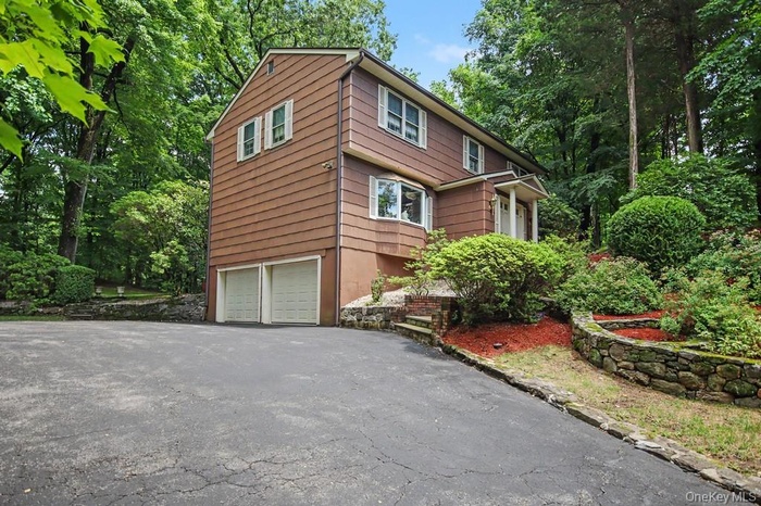 Attached two car garage and driveway parking