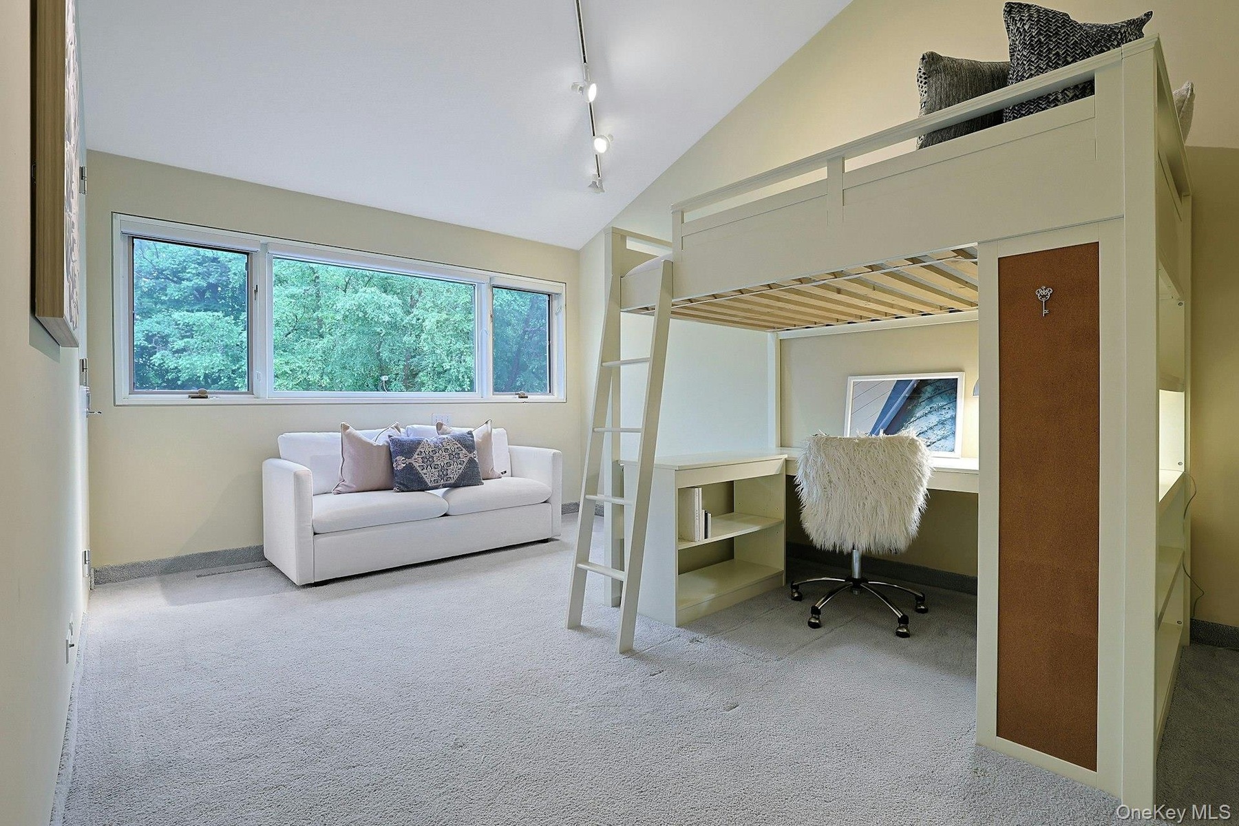 A bedroom with ensuite bath creates an ideal retreat with beautiful green views.
