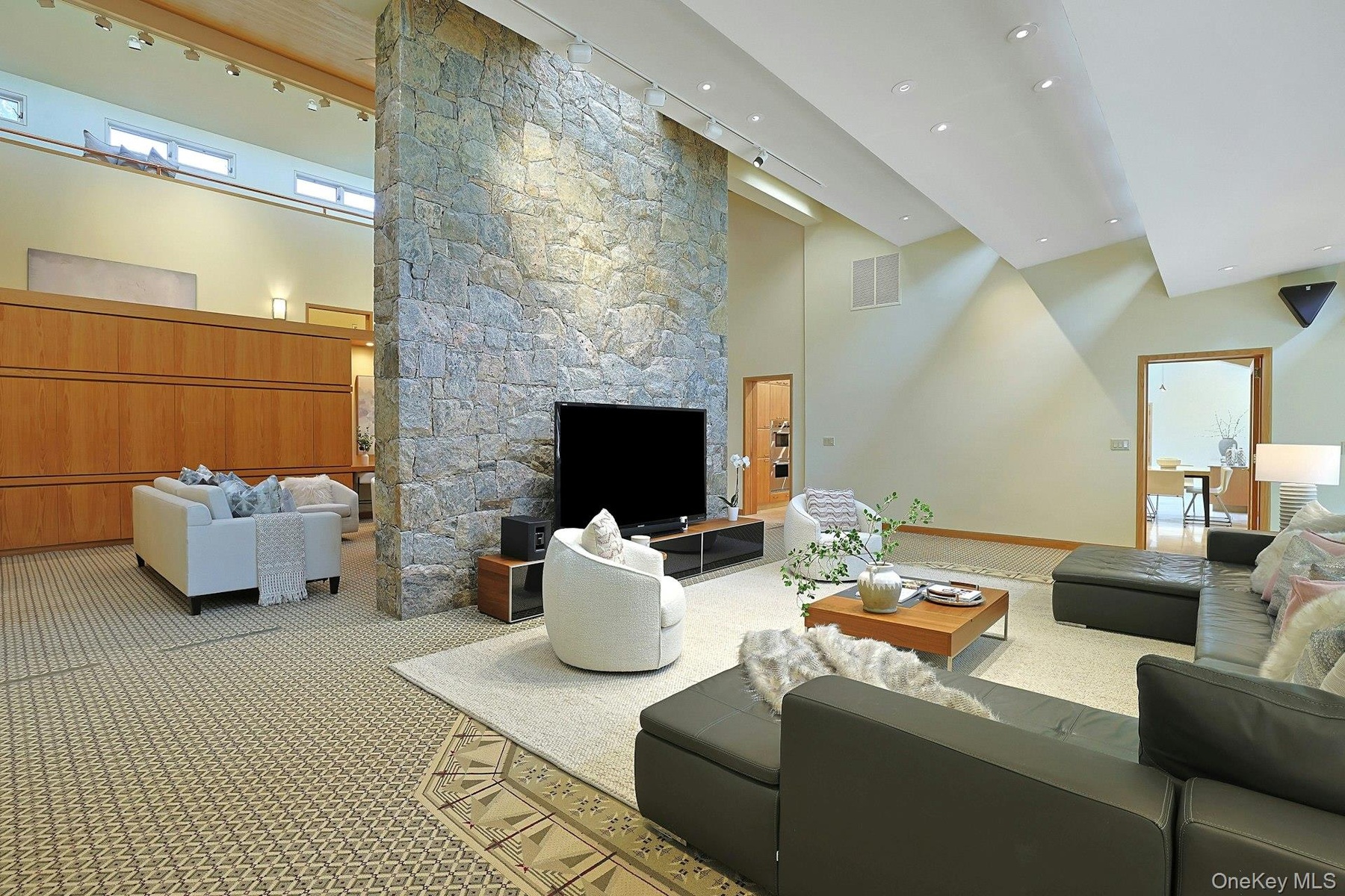 Thoughtfully designed skylights make an unusual architectural design within the open space creating visual interest.