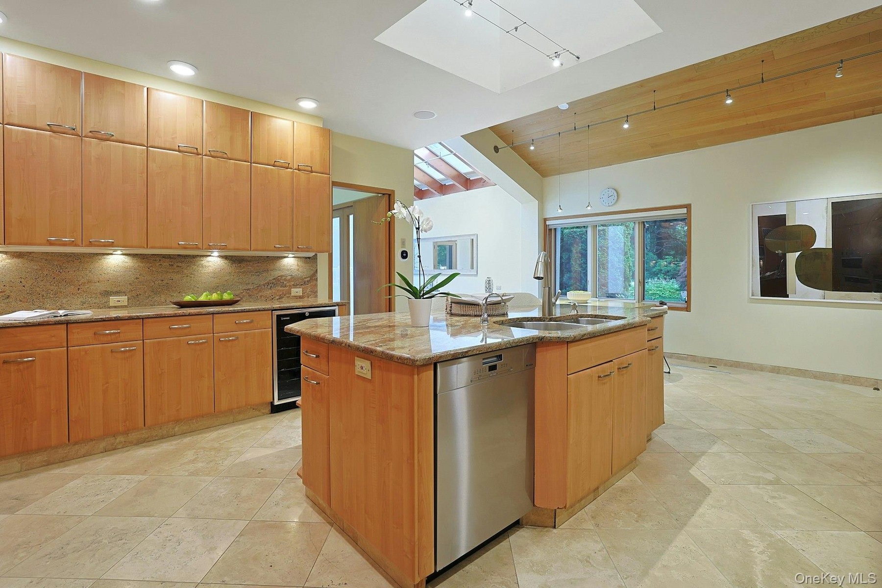 Thoughtfully planned for both everyday living and entertaining, the kitchen offers generous workspace, exceptional storage, and timeless finishes.
