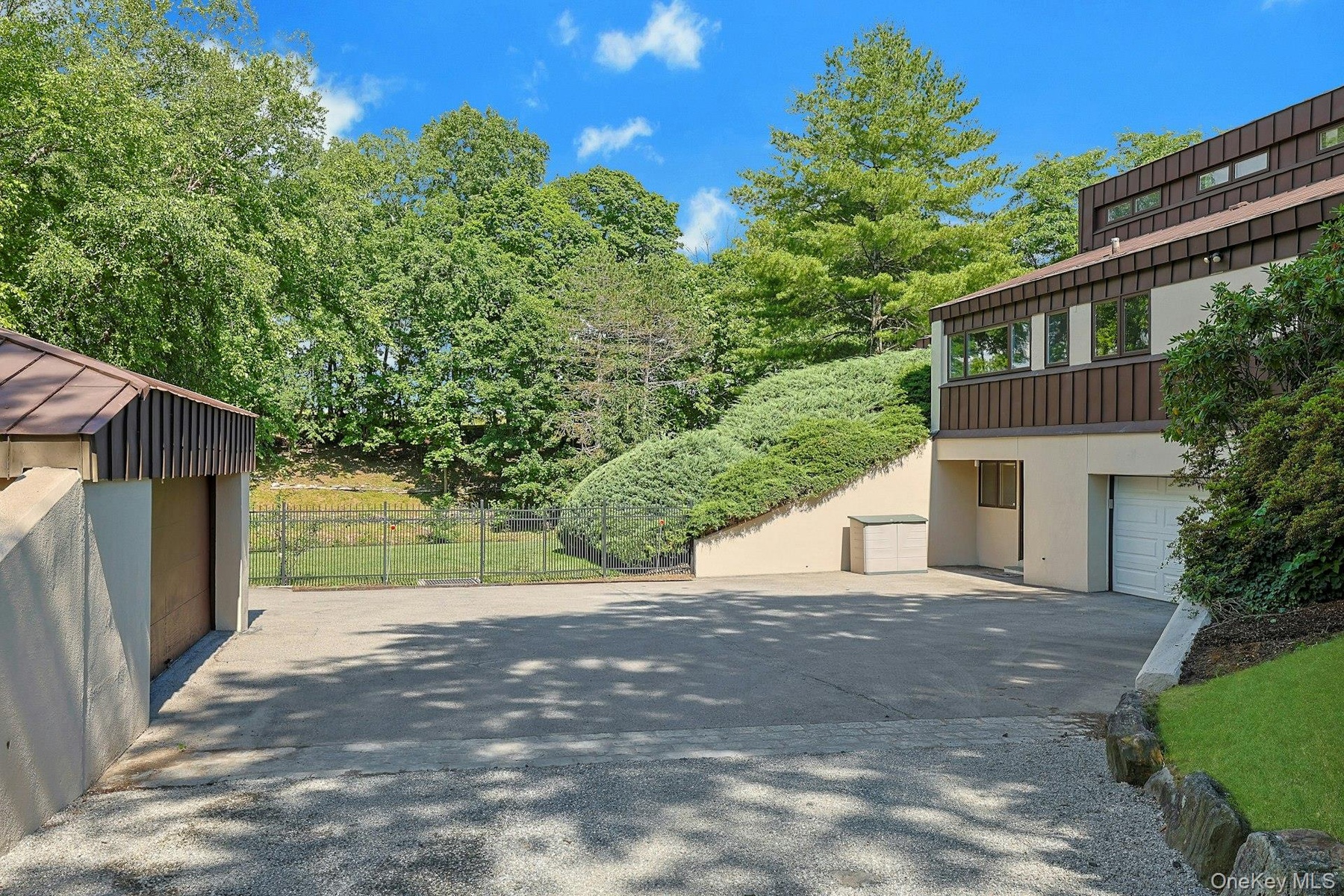 Multiple parking areas, including access to both attached and detached garages, offer exceptional convenience for residents and guests alike.