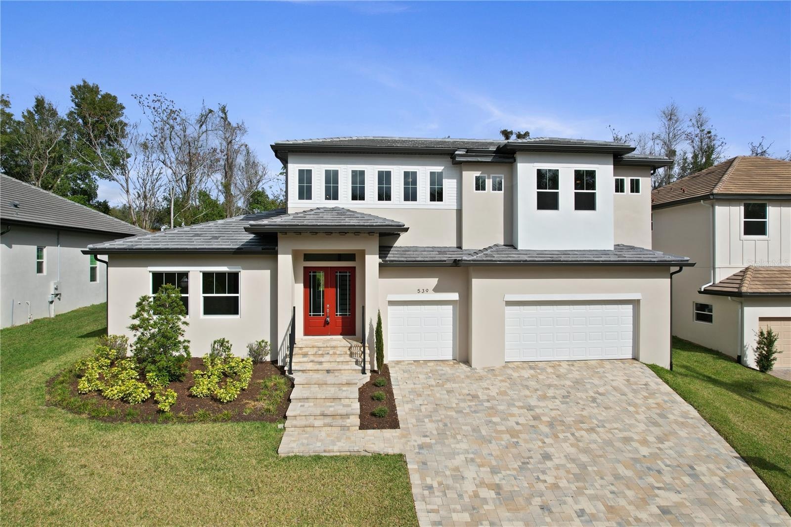 New - custom-built home showcases stunning curb appeal with a modern design, beautiful paver driveway, 3 car oversized garage.  Meticulously manicured