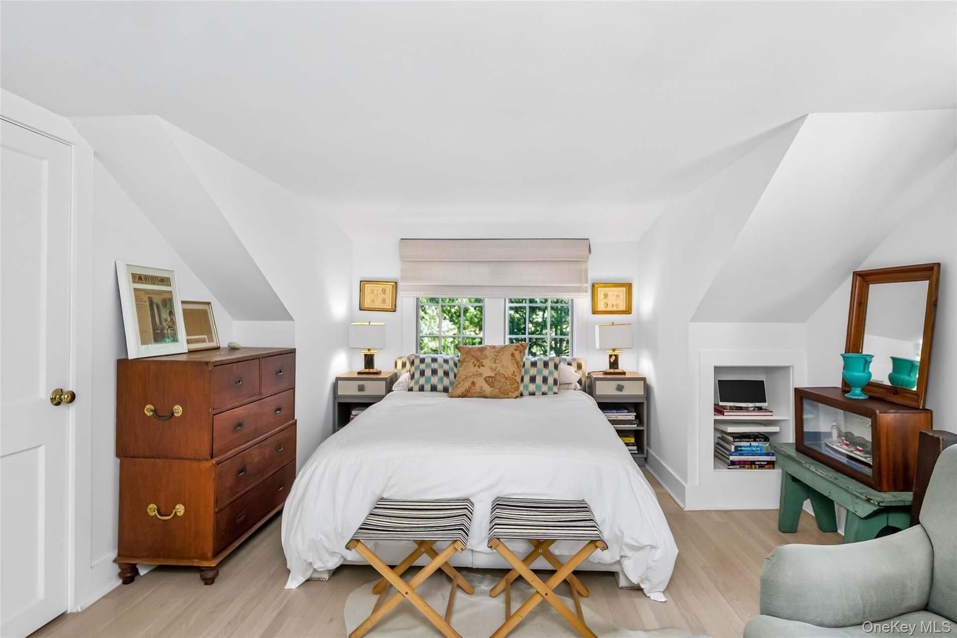 2nd floor Primary Bedroom featuring light wood-finish flooring, white walls, and a window with a roman shade