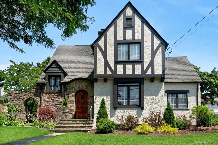 Tudor-style exterior featuring stucco and timber framing