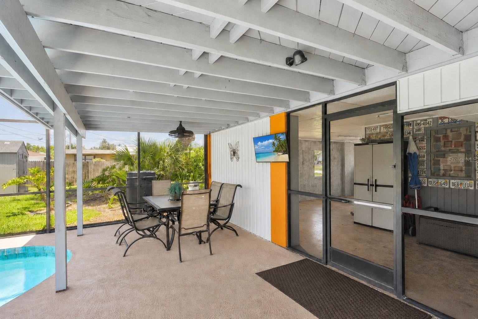 overed patio area adjacent to the pool, ideal for outdoor entertaining.