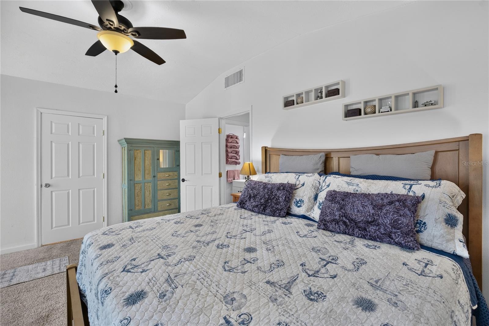 Spacious primary suite with ample room and natural light.