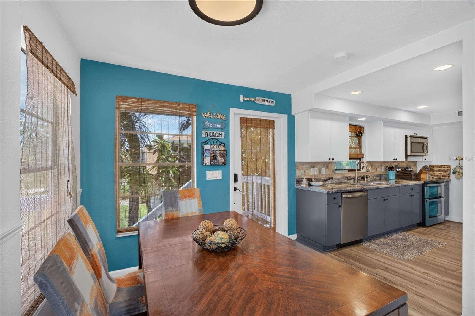 Dining space adjacent to the kitchen (front door visible)