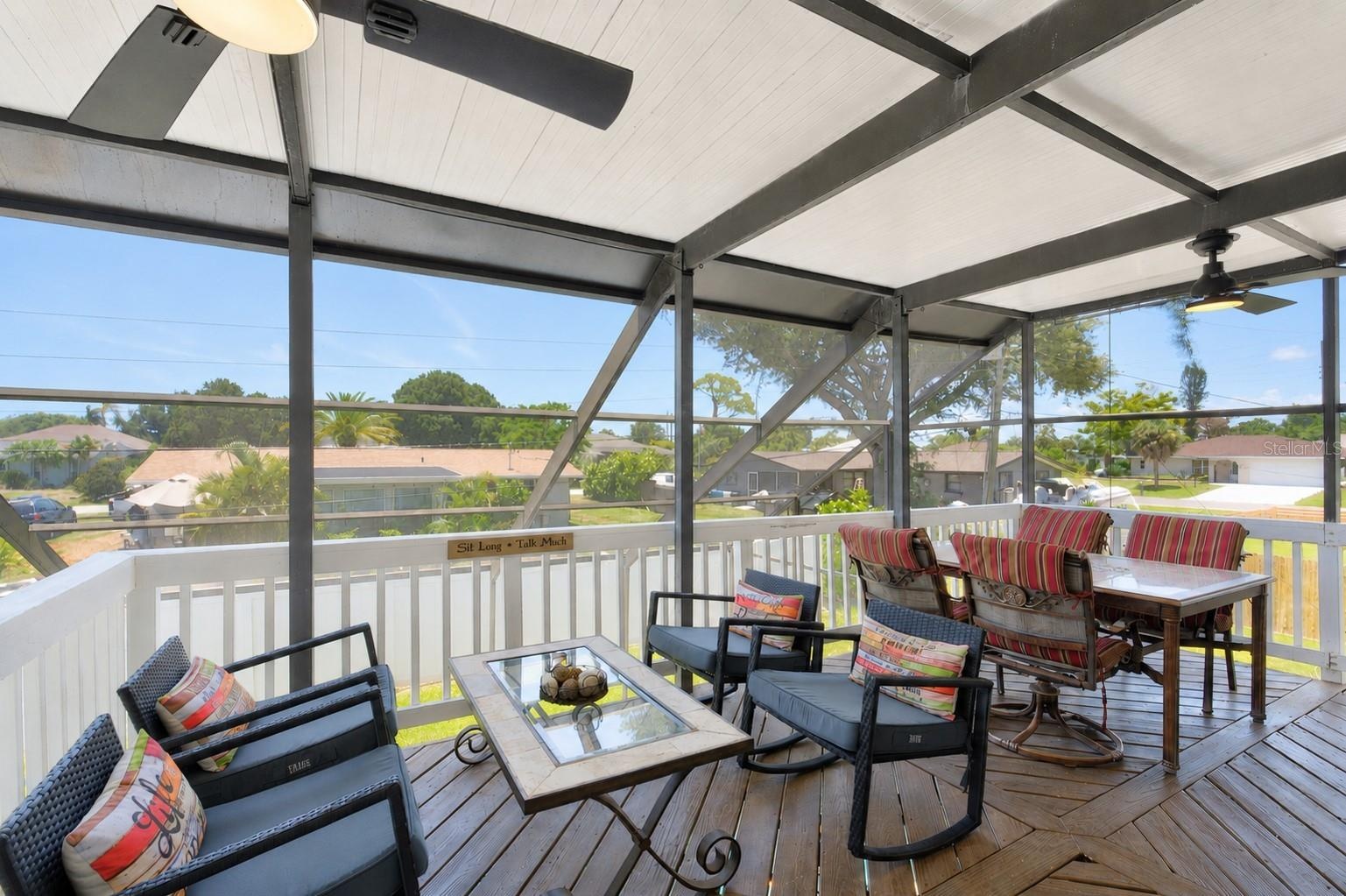 Large covered deck overlooking pool