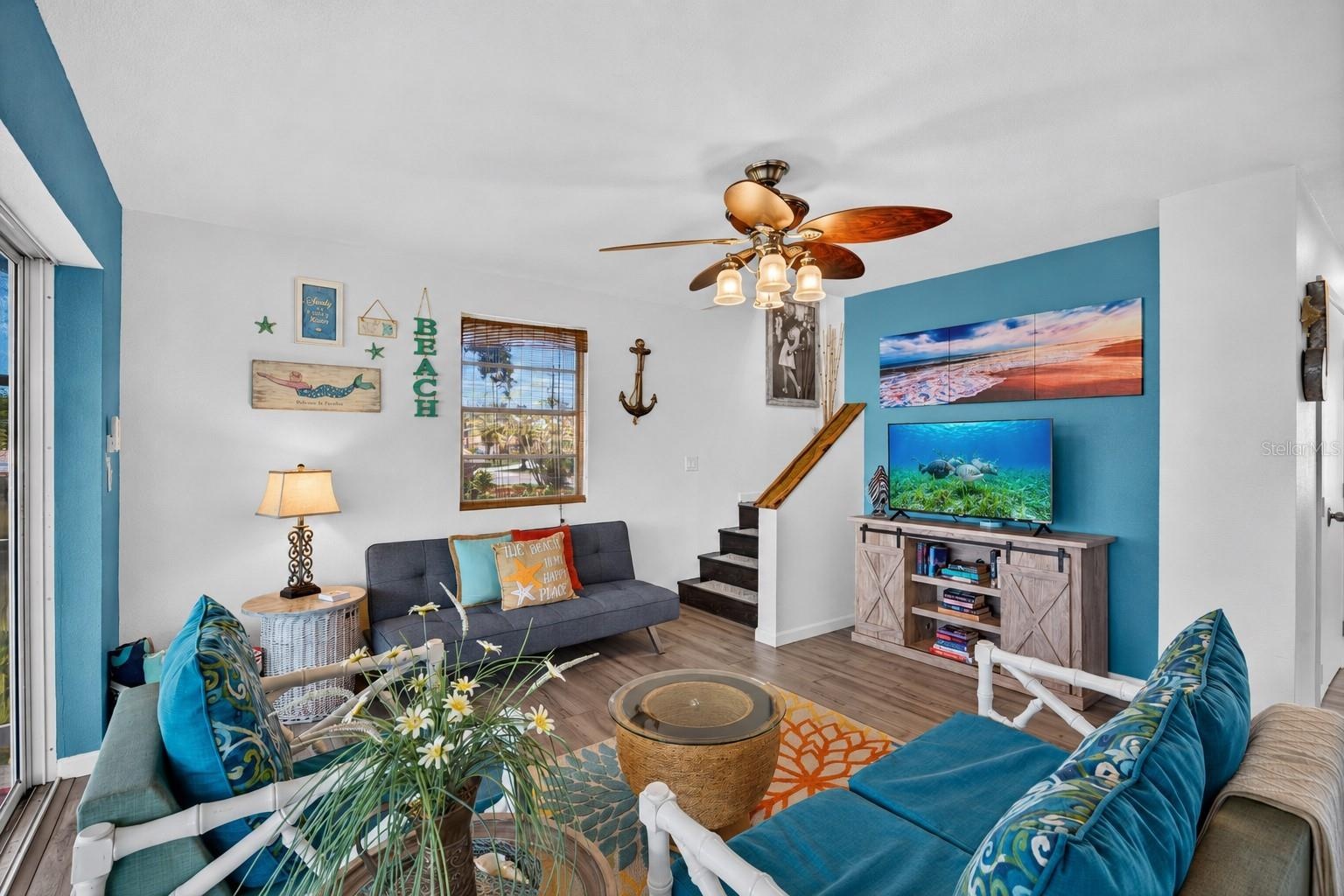 Family room with view to upper level stairs.