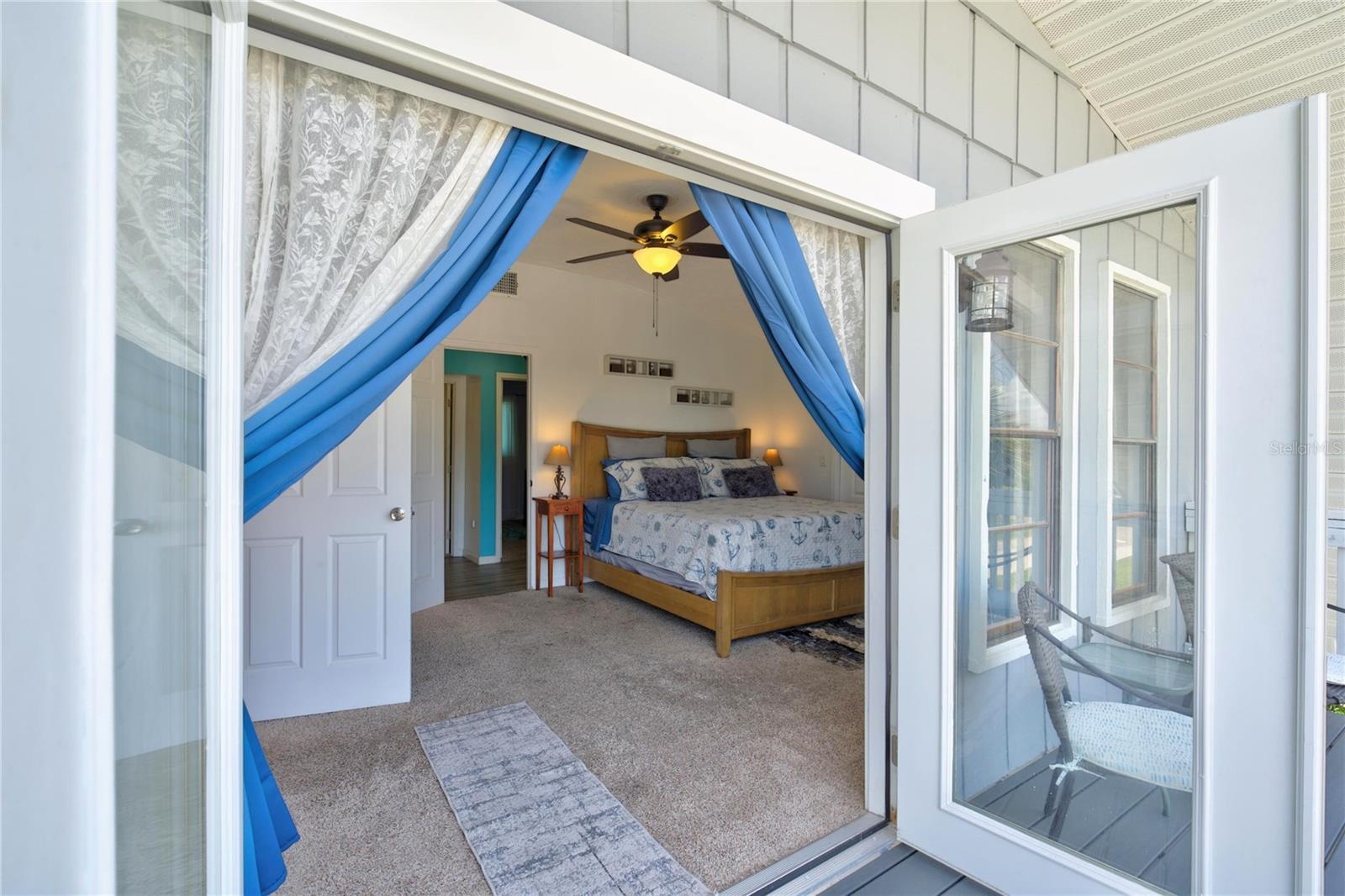 Private deck looking into Primary bedroom