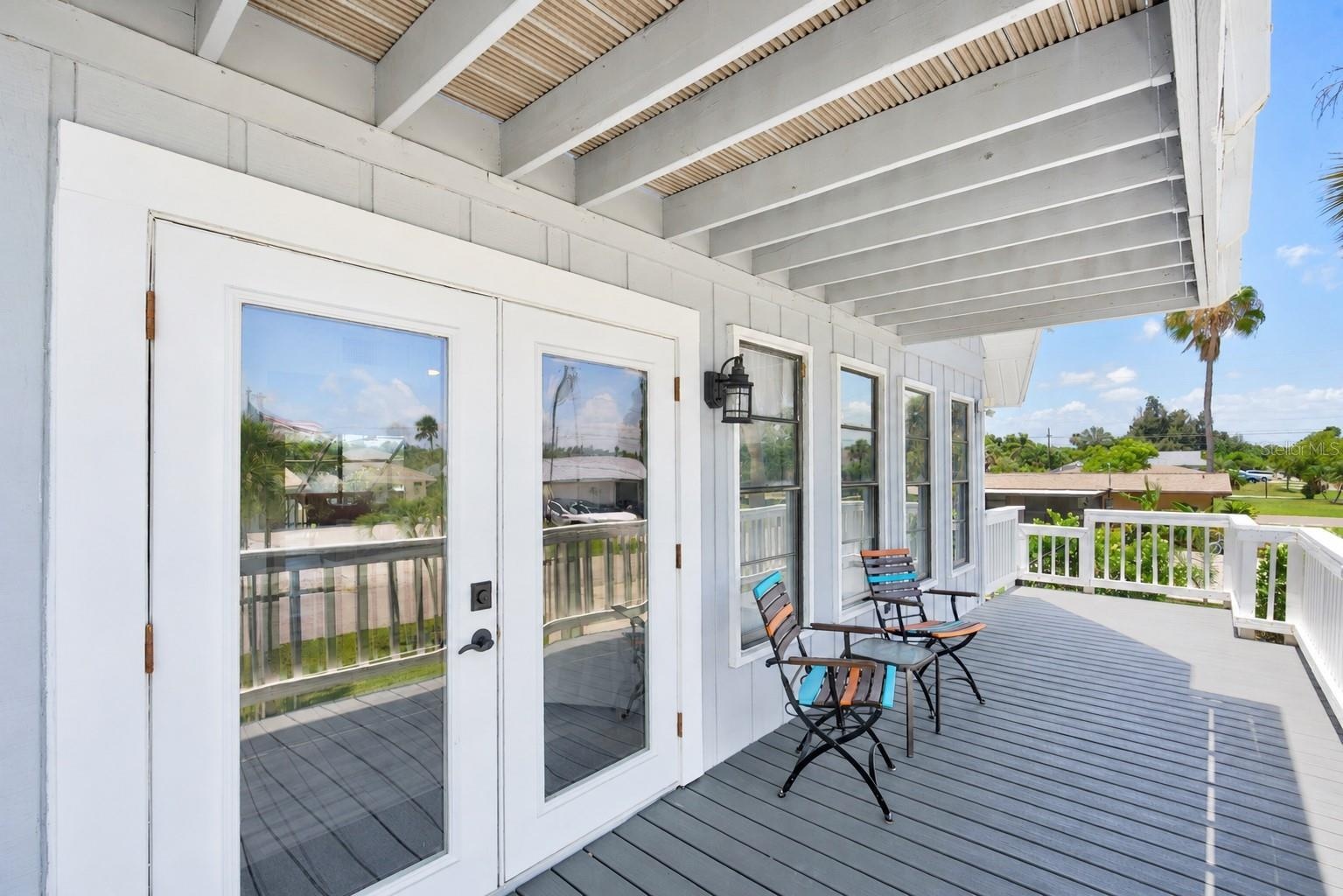 Covered deck seating area with French door access to the livingroom.