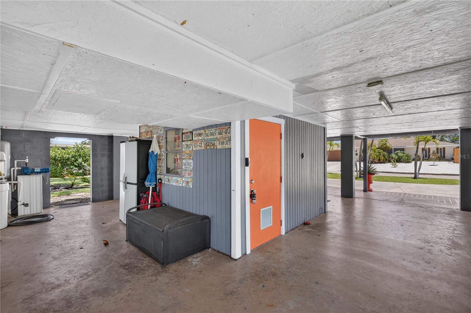 Carport with door to locked storage