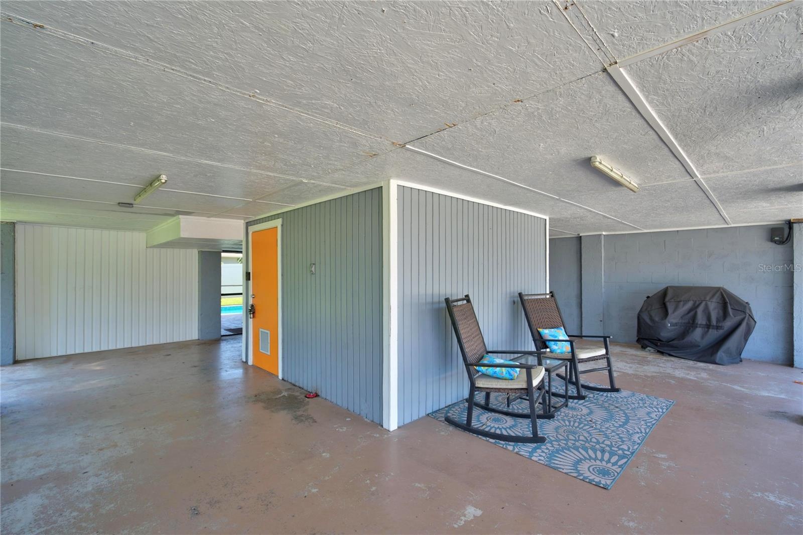 Carport with door to locked storage