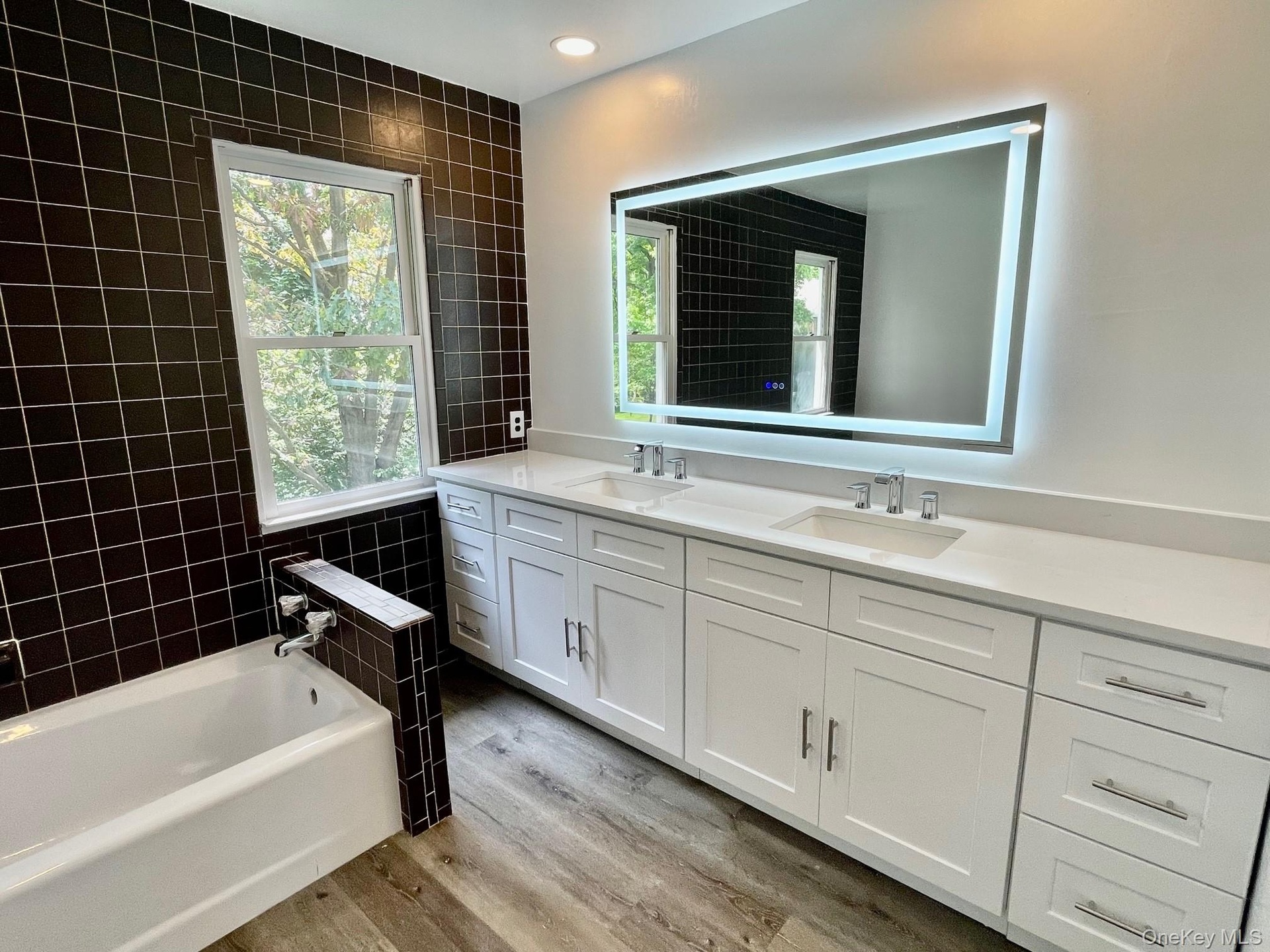 Primary bathroom with double sink vanity