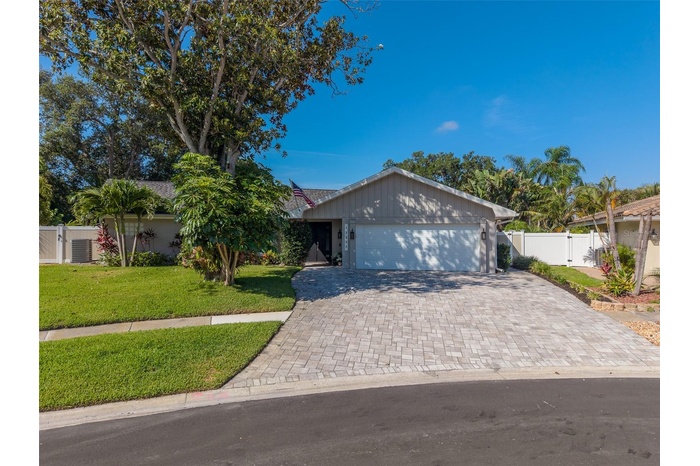 Exterior of home with newly pavered driveway