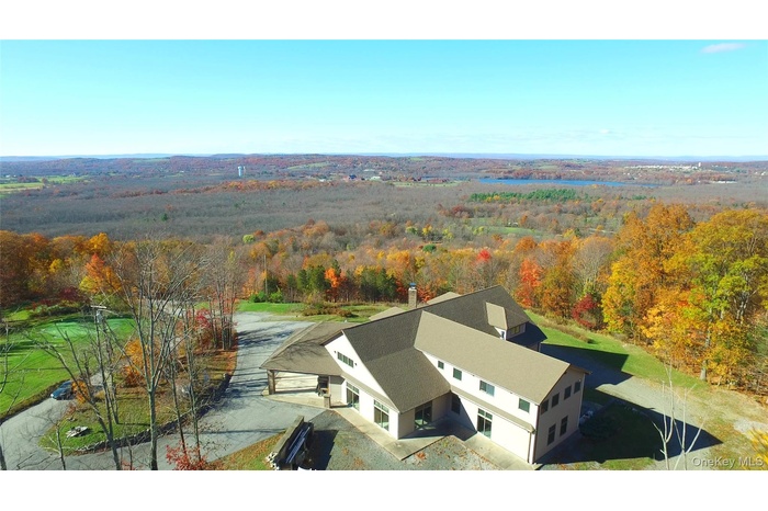 Extraordinary, stop in your tracks views can be yours year-round.  This home is perched above the sought-after Warwick Valley, including Wickham Lake 
