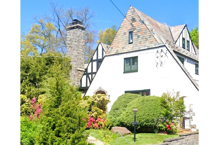 Offered for the first time in over 20 years, 133 Bon Air Avenue is a timeless Tudor distinguished by its iconic stone chimney, classic architecture, a