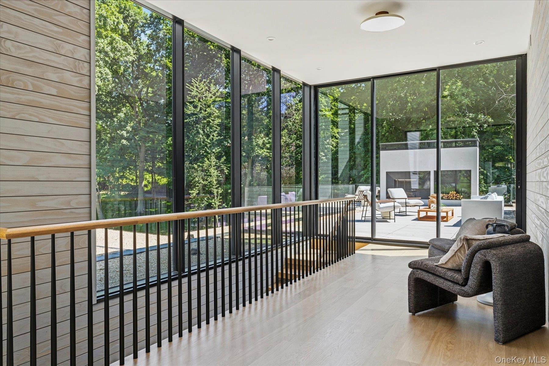 Second floor hallway with access to 1300 sf terrace with  wood burning fireplace