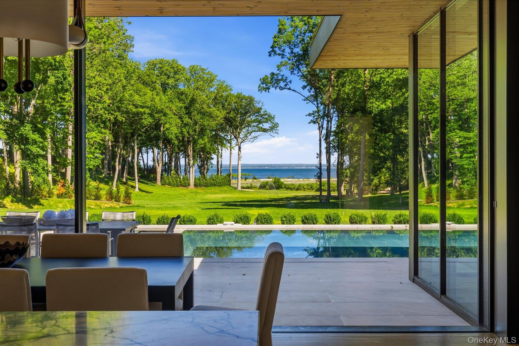 Water views and pool access through retractable glass