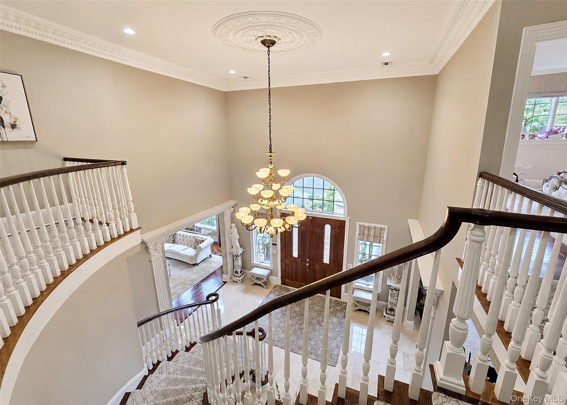 Masterfully Designed Two Story Grand Staircase