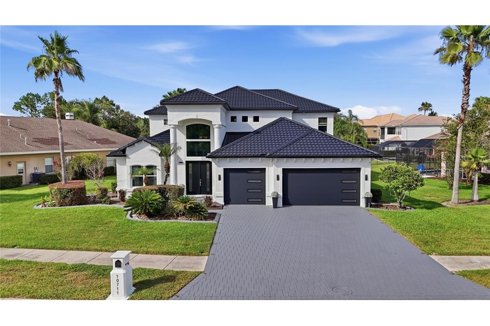 Impressive curb appeal that comes from new metal roof, new double pane windows and new exterior paint with hurricane impact garage door and font door