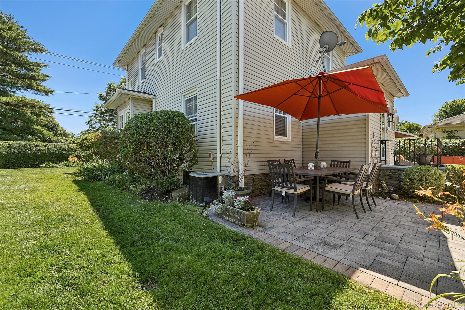 Side yard and paver patio in back of house