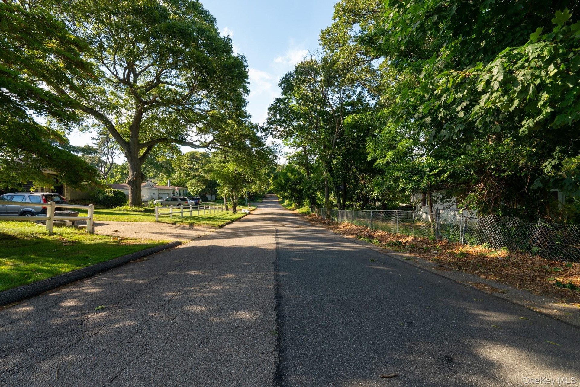 View of Spectacle Lake Drive from Smithtown Blvd. Property on Right side
