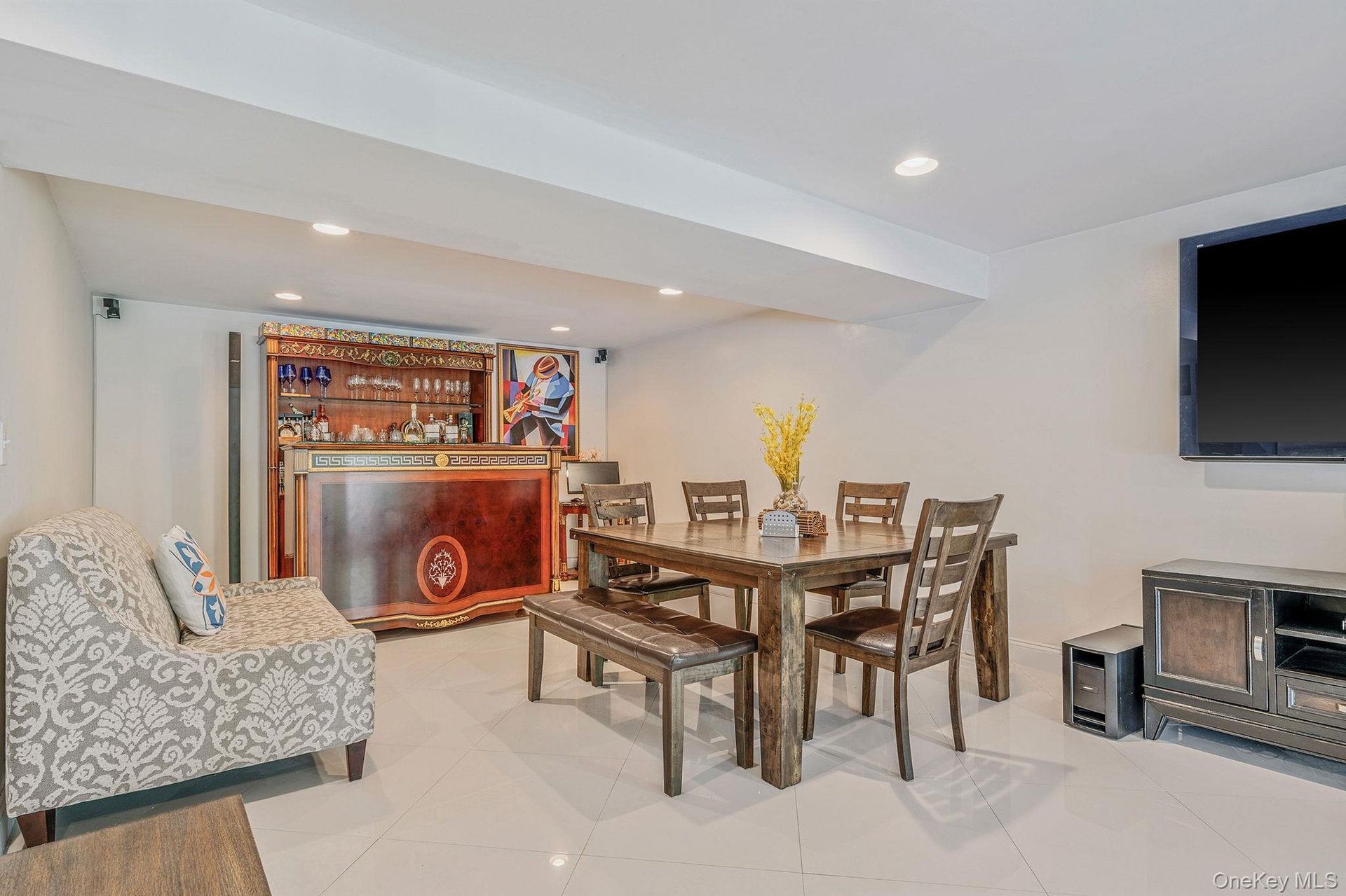 Dining area with recessed lighting and light tile patterned floors