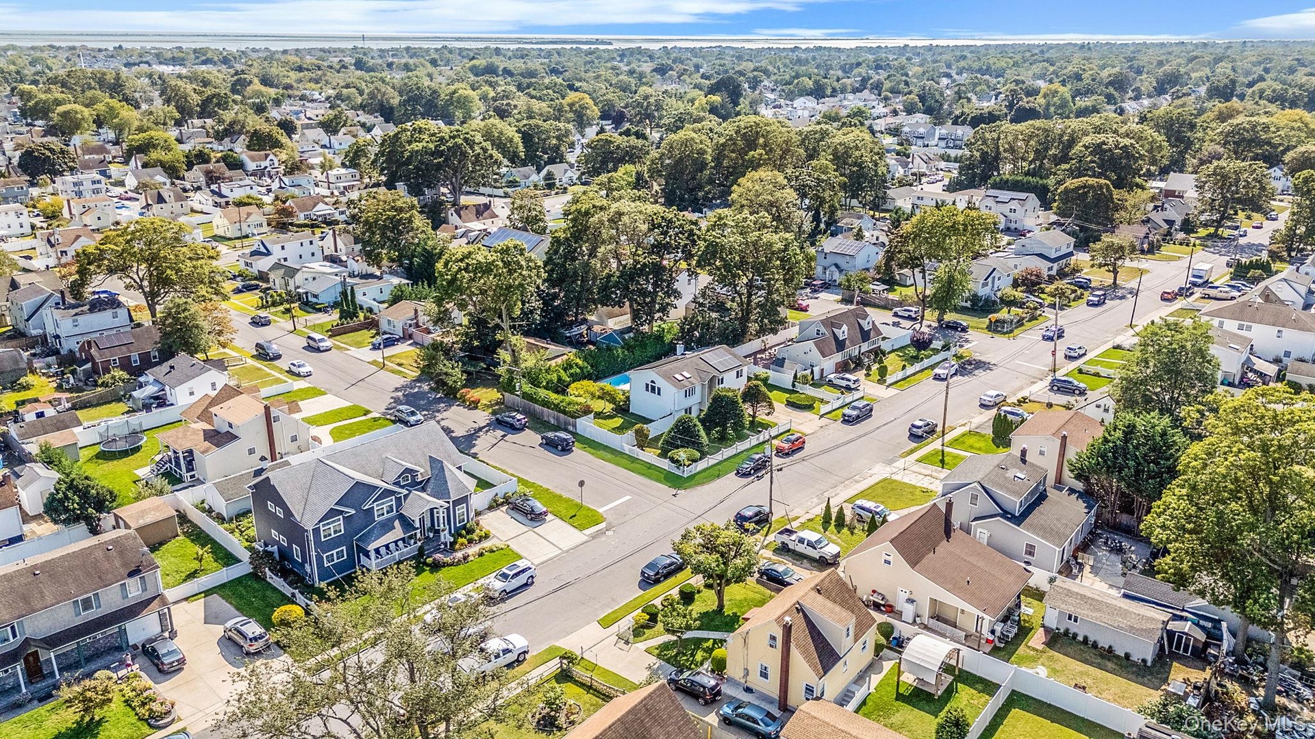 Aerial view of property's location featuring nearby suburban area