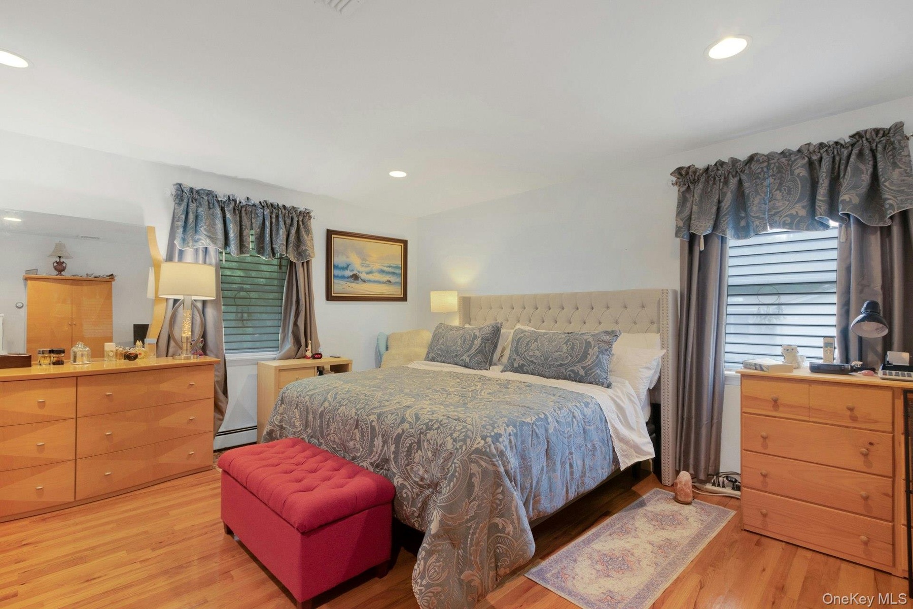 Primary bedroom with hardwood floors, recessed lighting, walk-in closet and luxury spa-like ensuite barthroom