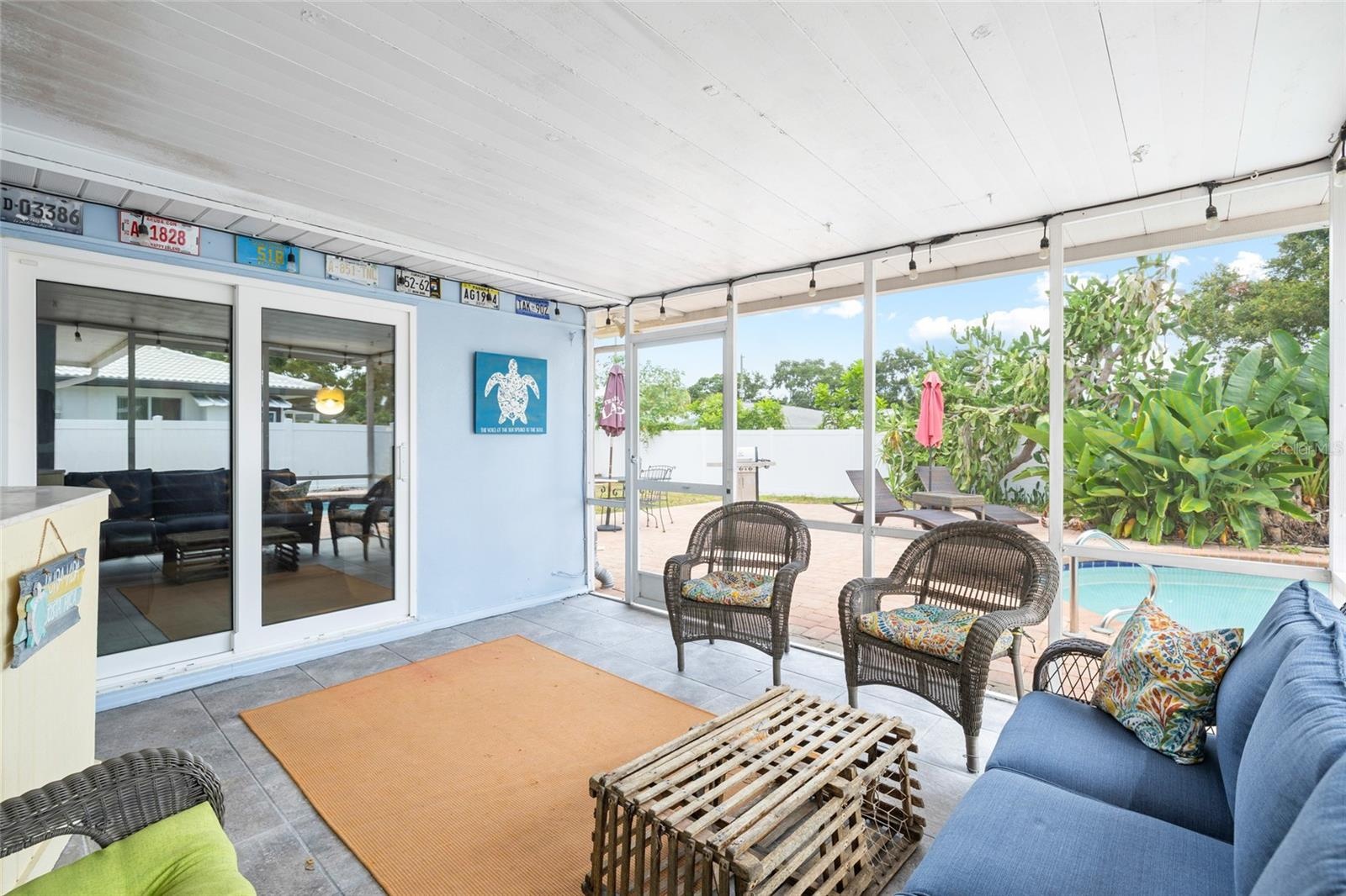 Enlosed Rear Patio overlooking the Pool