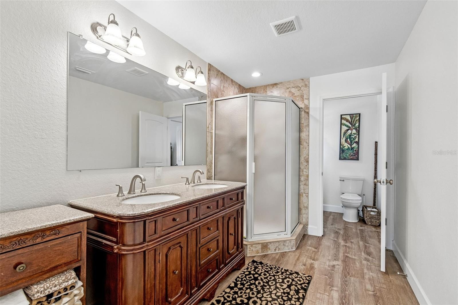 Main full size bath- dual vanity, water closet