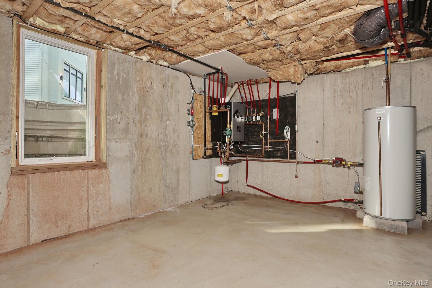 Utility room featuring gas water heater