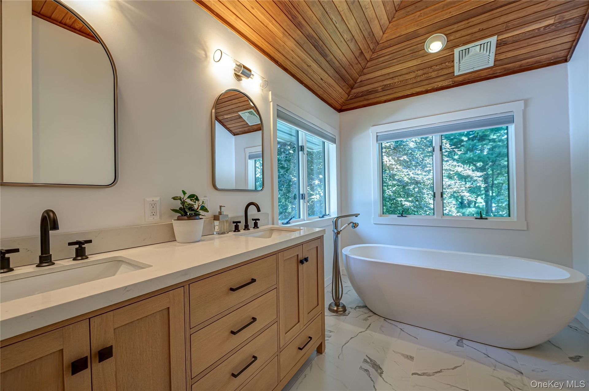 Brand new Master Bathroom with double sinks, shower and free standing tub.