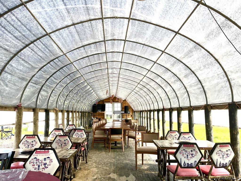 Sunroom with lofted ceiling