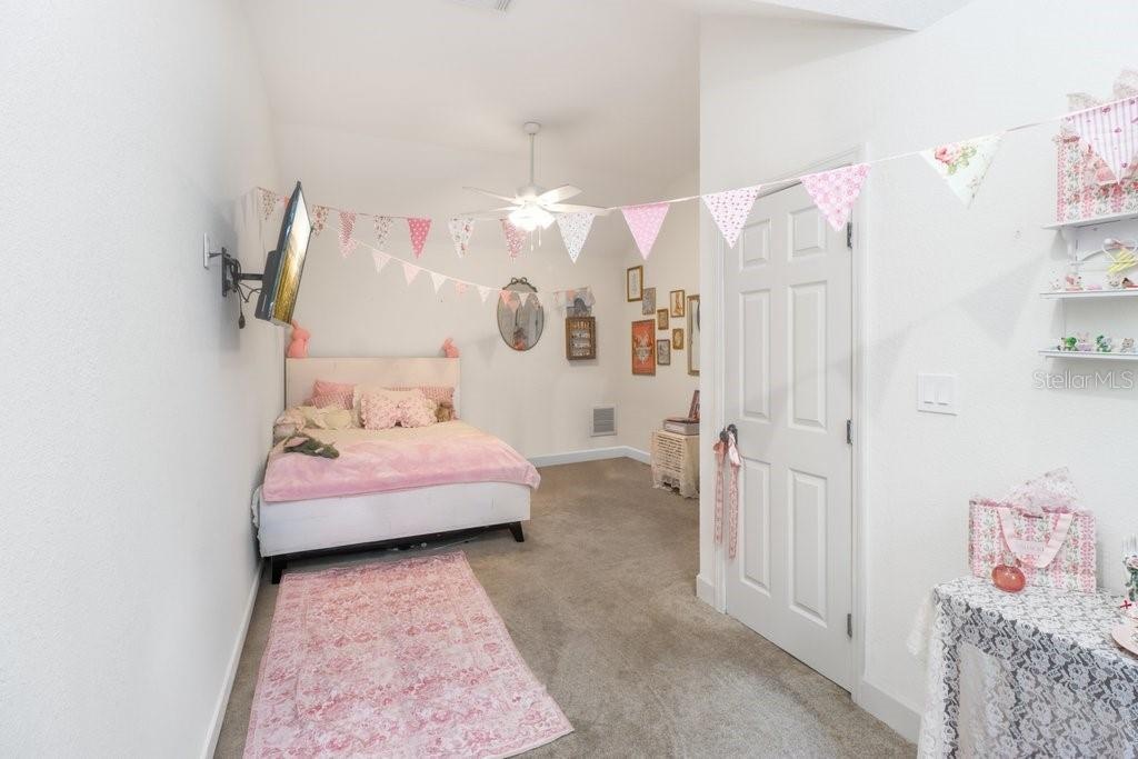 Spacious bedroom with plenty of space for queen sized bed and large walk in closet.