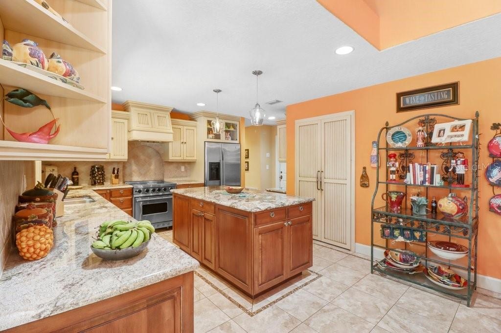 Another great view of the custom kitchen and pantry doors