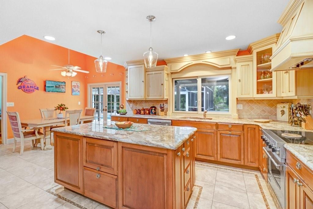 Kitchen island includes plenty of storage and built-in microwave.