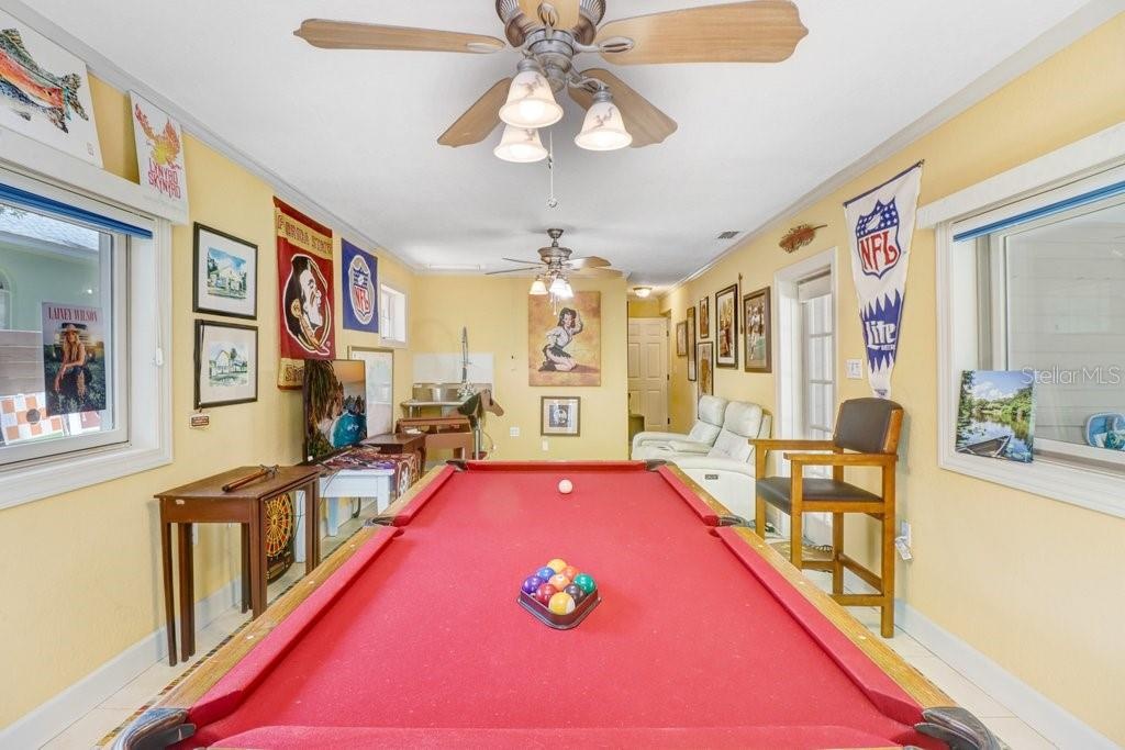 Another view of the game room with plenty of space for a pool table.