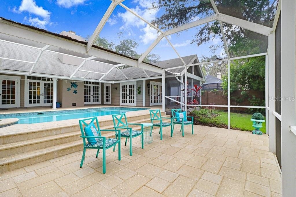 Step down patio area overlooking the backyard.