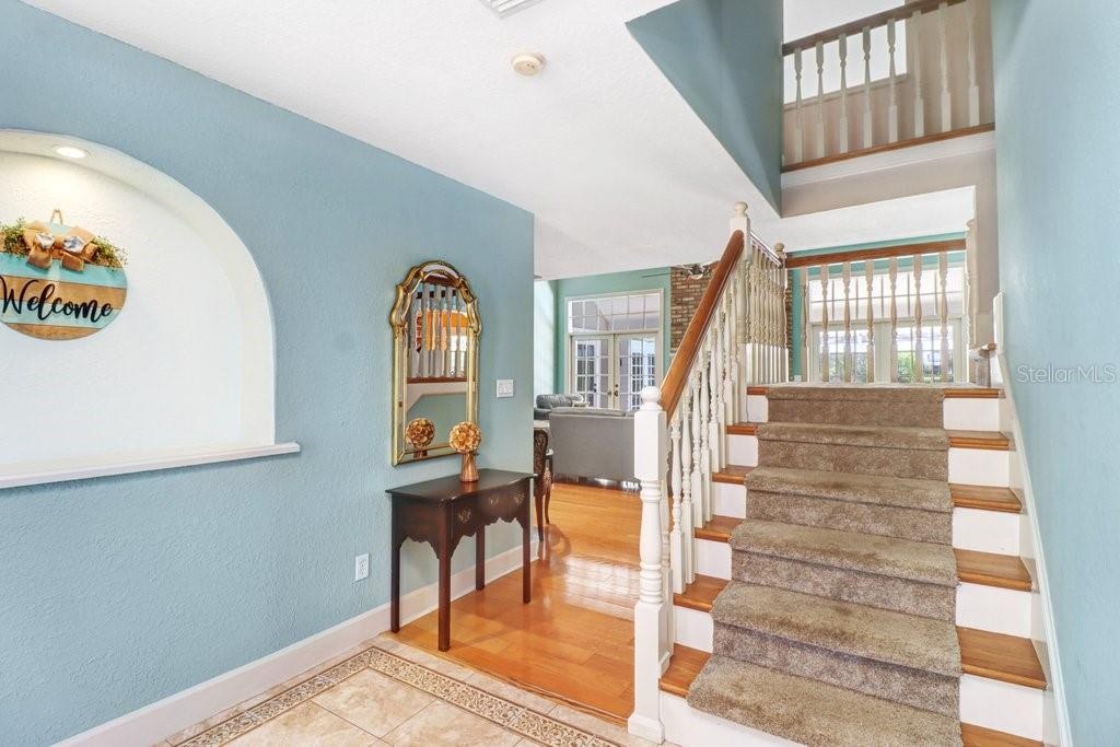 Take the stairs up to the 2nd floor to view the 3 bedrooms and bathroom upstairs.