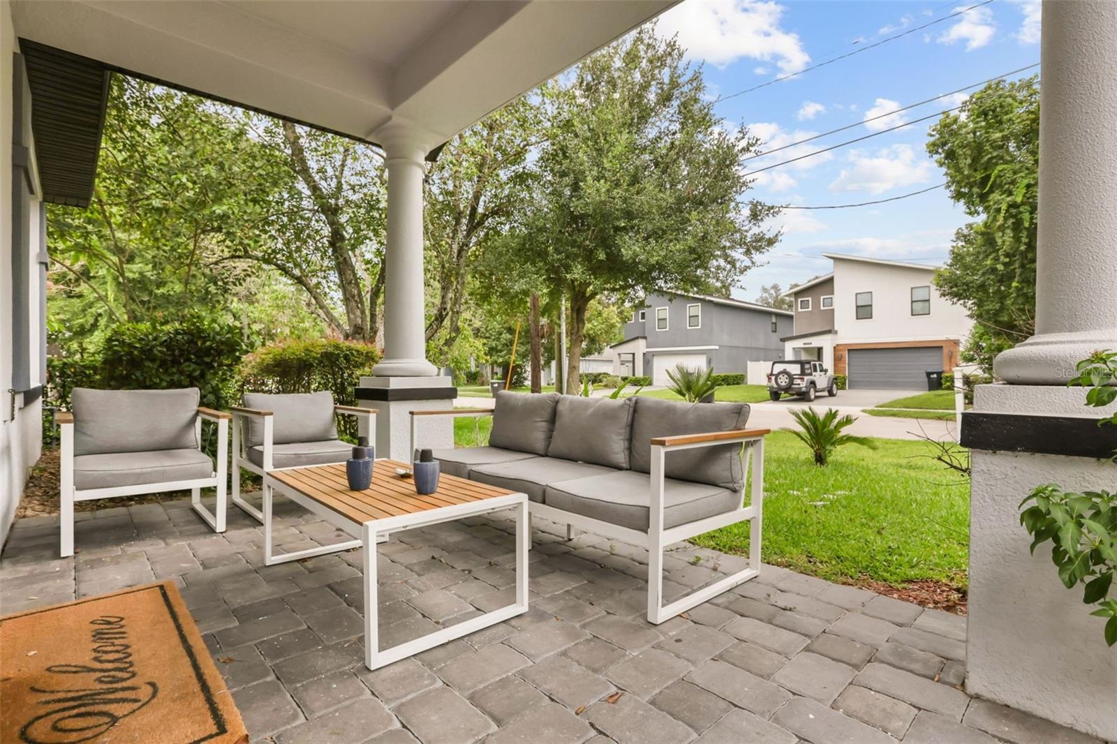 Welcoming front porch offering the perfect space to relax and enjoy the neighborhood setting.