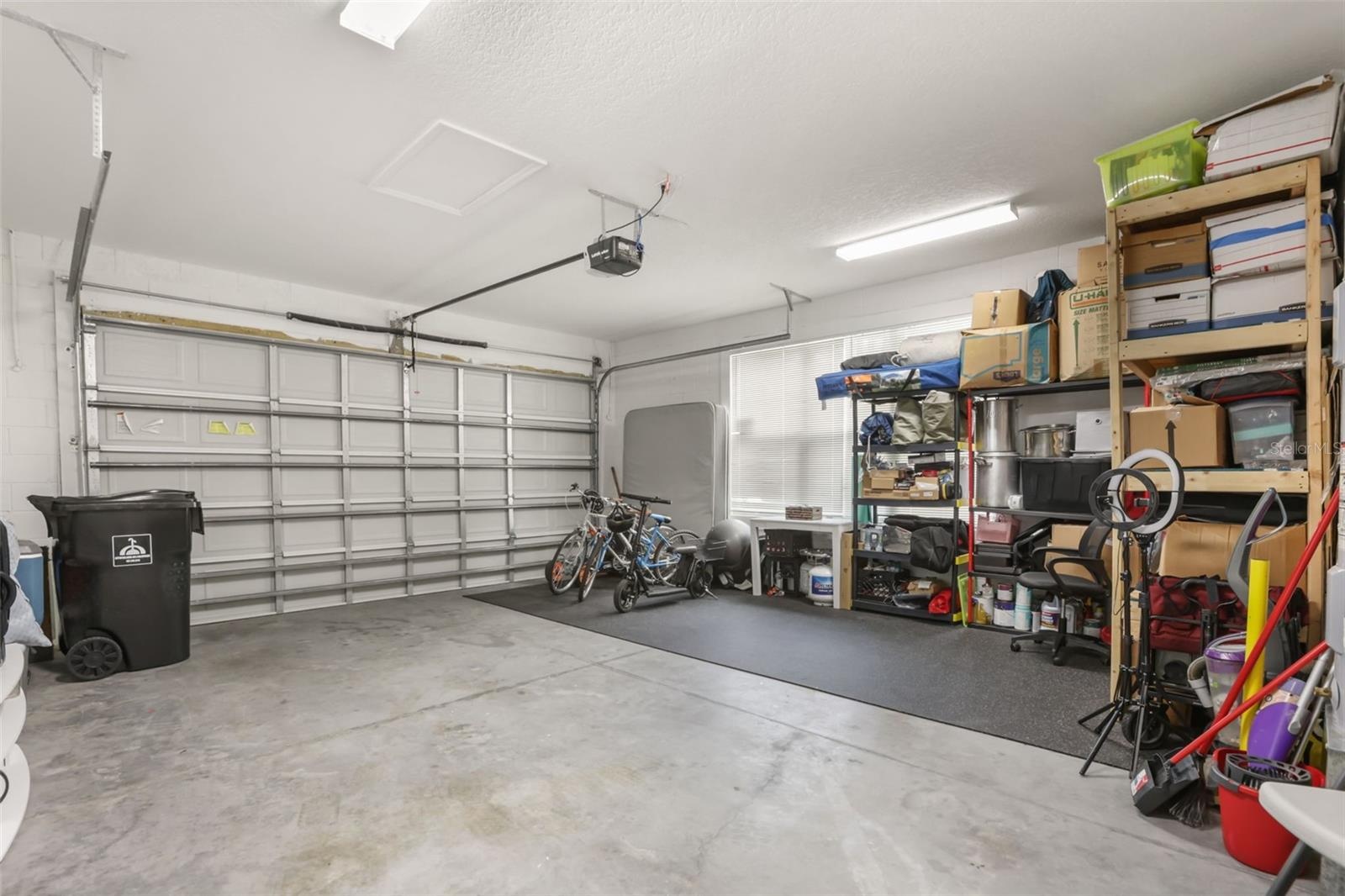 Oversized 2-car garage featuring generous storage space and room for vehicles, tools, and recreational equipment.