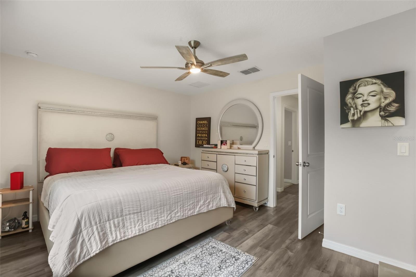 Spacious primary suite featuring abundant natural light and a private en-suite bathroom.