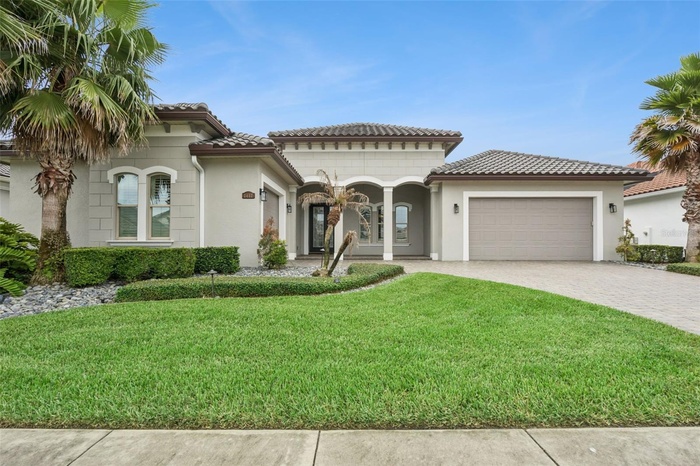 Front exterior with manicured landscaping