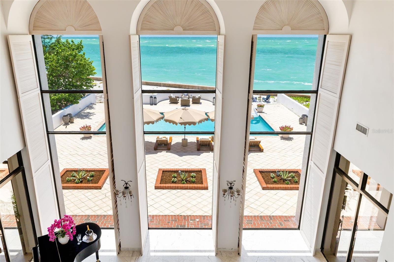 The second-story gallery showcases the dramatic architectural focal points of the home from different views