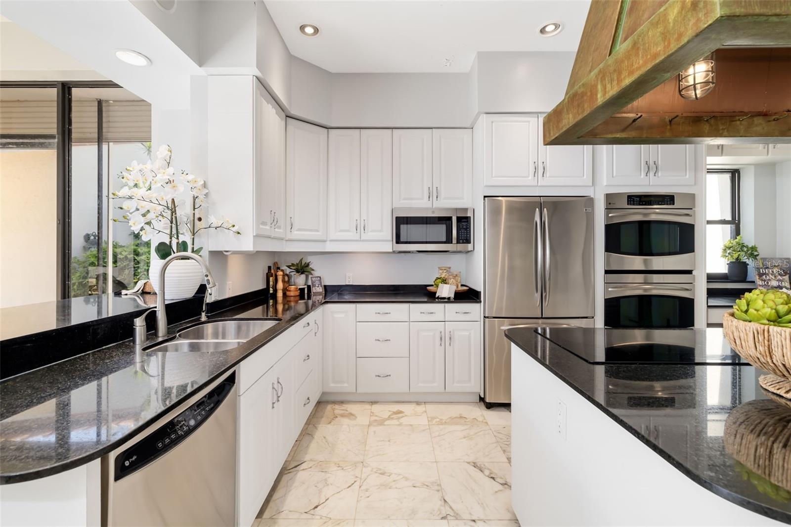 There are 2-Sinks, 2-Dishwashers, 2-Refrigerators, 2-Ovens and gas for the stove...  Anyone entertaining or a gourmet will appreciate the space and th