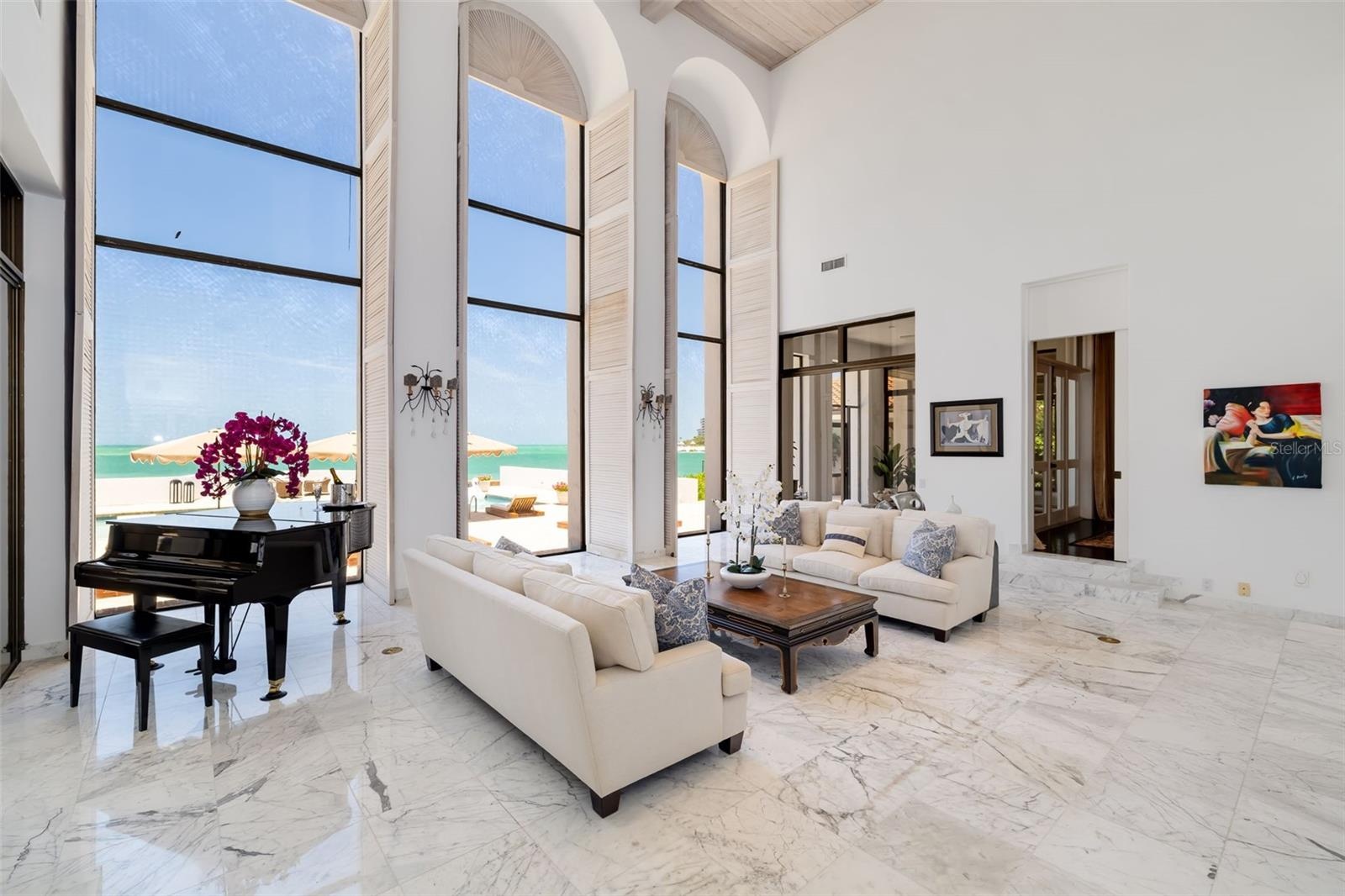 One of the entrances to the formal dining room from the gathering room seen here along with the terrace off of the formal dining room