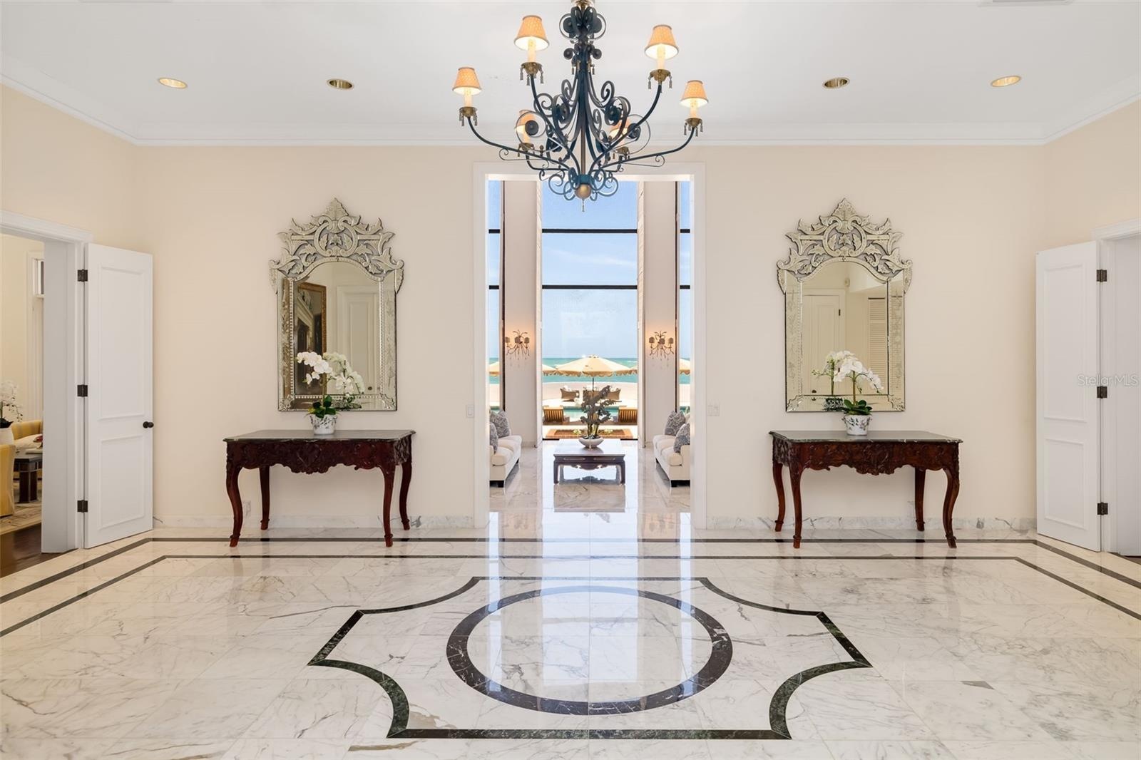 We meet you in the grande foyer where you are immediately captivated by the 2-story ocean views...